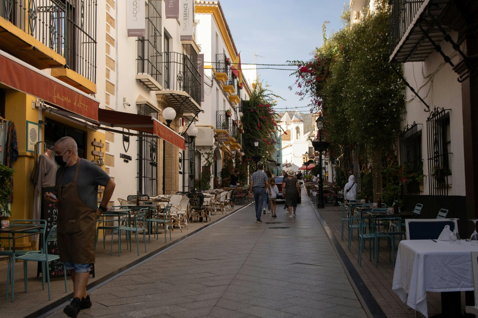 A colorful, sunlit cobblestone street in a historic European city, illustrating travel ideas for the best European cities to visit in 2025.