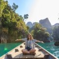Happy senior solo traveler enjoying a guided tour adventure, exploring a beautiful destination with confidence and freedom.