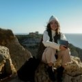 Happy senior woman confidently enjoying solo travel in a beautiful destination, symbolizing freedom, adventure, and rewarding getaways for older adults.