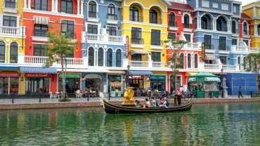 Historic European city street scene representing affordable travel destinations like Lisbon, Prague, Budapest, and Krakow for budget-friendly vacations.