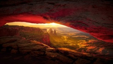 The dramatic red rock formations of Valley of Fire State Park glow under a warm sunset, a stunning example of the Las Vegas desert landscape.