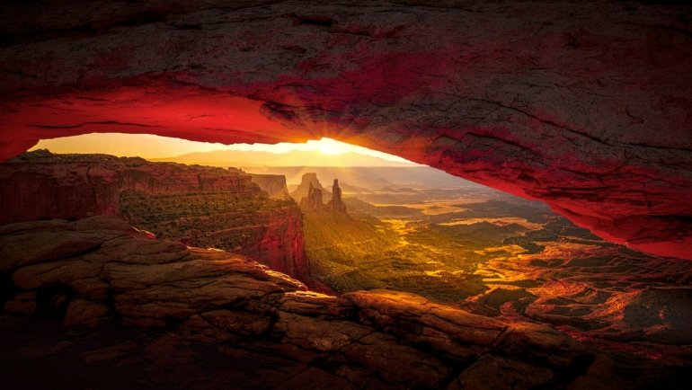 The dramatic red rock formations of Valley of Fire State Park glow under a warm sunset, a stunning example of the Las Vegas desert landscape.