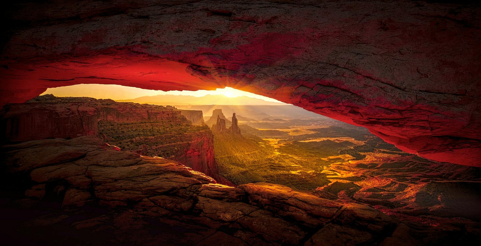 The dramatic red rock formations of Valley of Fire State Park glow under a warm sunset, a stunning example of the Las Vegas desert landscape.