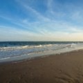 Beautiful sandy beach on the East Coast USA, highlighting top vacation spots and inviting Atlantic waters.