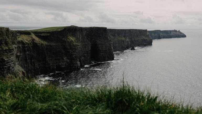 A stunning view of the Cliffs of Moher, one of the best things to see in Ireland, with its dramatic green cliffs overlooking the Atlantic Ocean on a trip in 2025.