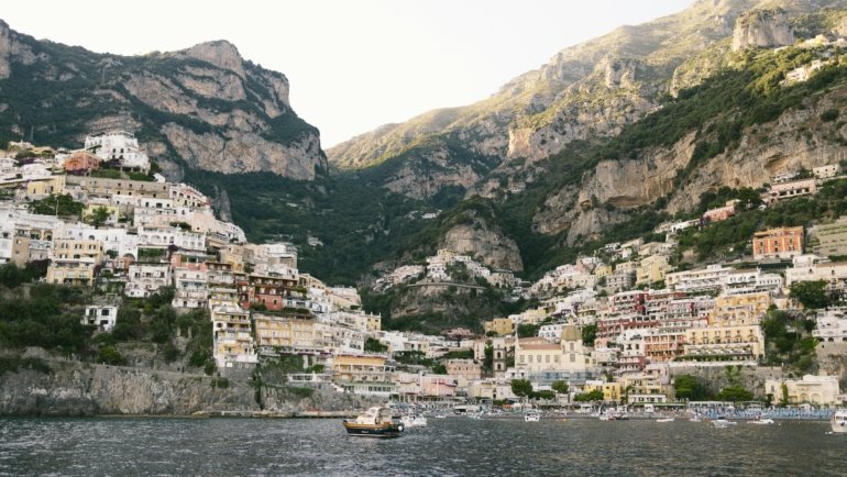 A scenic view of a colorful coastal village, one of the many beautiful holiday destinations in Europe discussed in the article.
