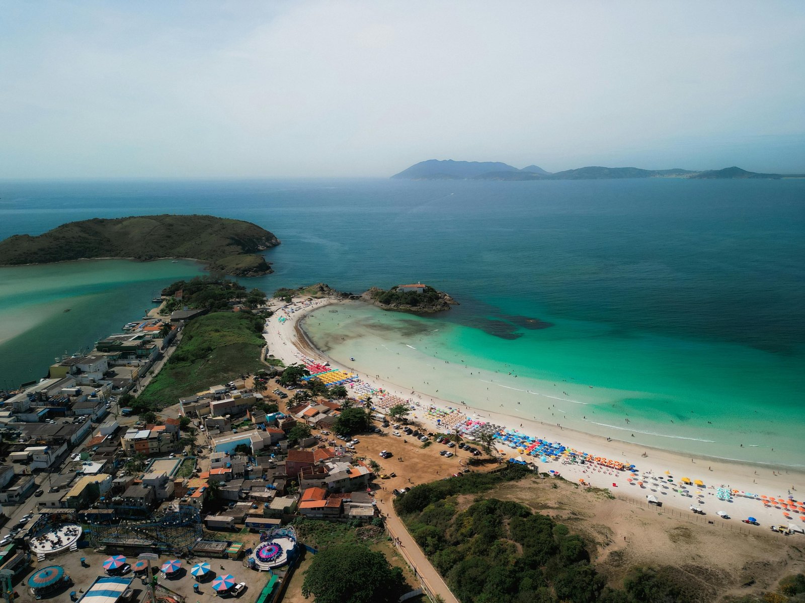 An aerial view of the stunning white sand beaches and turquoise waters of South Padre Island on a sunny day, showcasing a top destination for a Texas coastal getaway.
