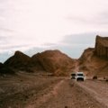 A spectacular sunset paints the otherworldly landscape of the Valle de la Luna in vibrant reds and oranges, a must-see stop on Atacama Desert Chile tours.