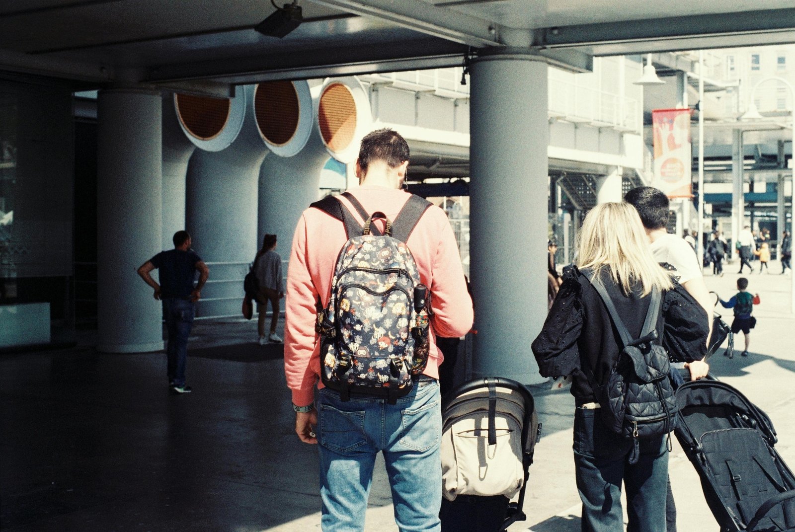 Happy backpacker exploring a vibrant budget-friendly city street, symbolizing affordable travel and smart backpacking tips.