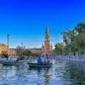 A wide, sunny view of the magnificent Plaza de España in Seville, a key highlight in a 10-day Spain travel itinerary.