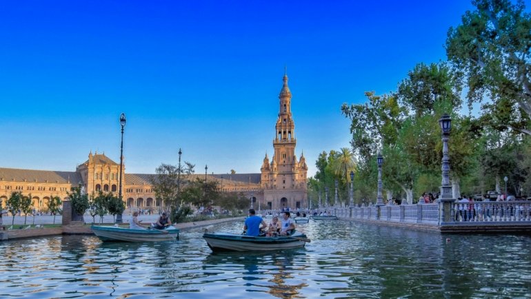 A wide, sunny view of the magnificent Plaza de España in Seville, a key highlight in a 10-day Spain travel itinerary.