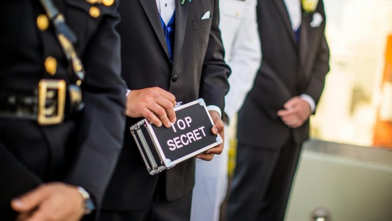A government employee or service member confidently reviewing DoD travel policy and JTR regulations, symbolizing clarity and effective planning for official government and military travel.