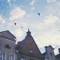 A colorful photo montage of the best cities to visit in Europe, featuring landmarks like the Eiffel Tower in Paris, the Colosseum in Rome, and a tram in Lisbon.