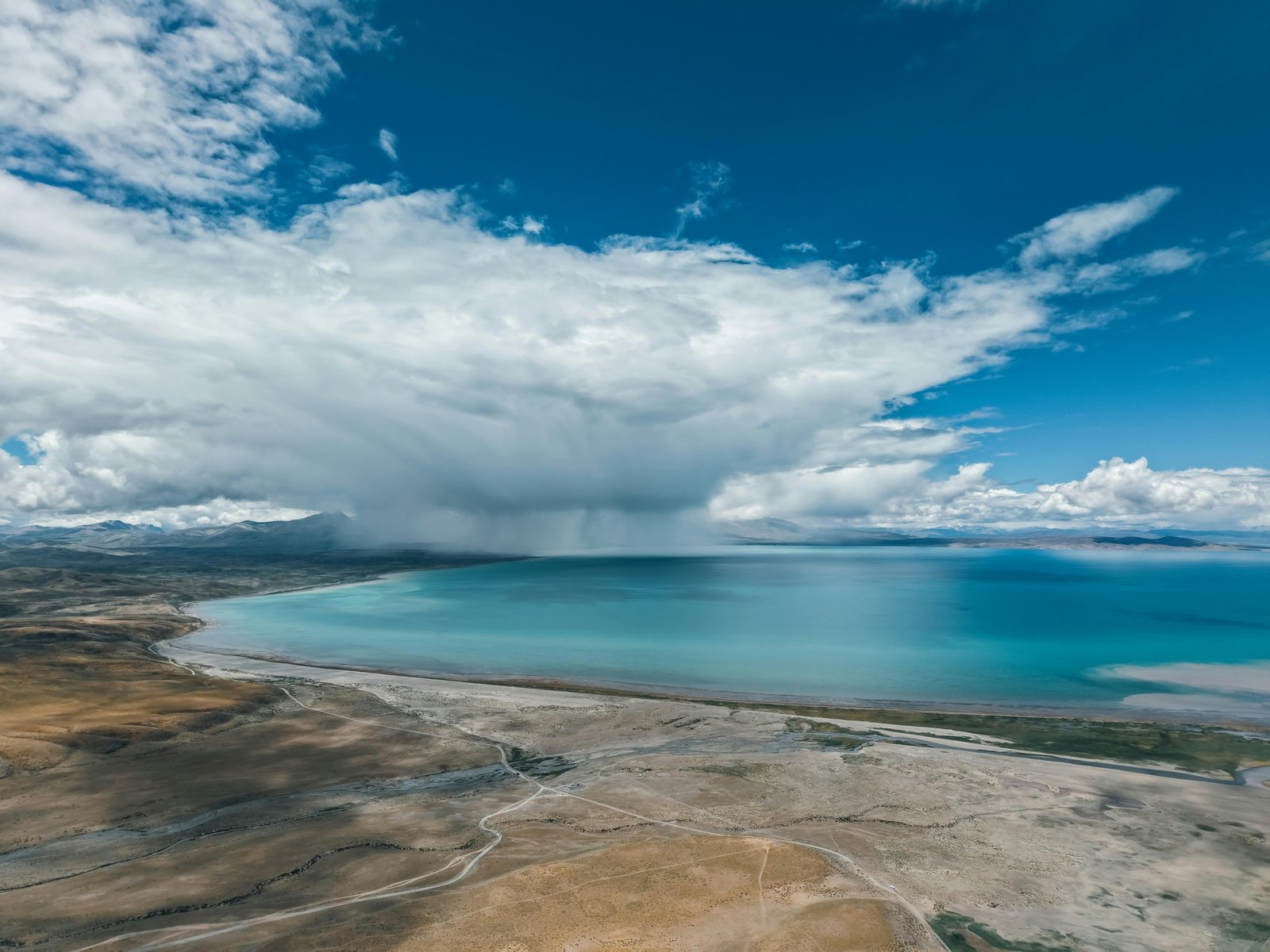 A stunning montage of diverse natural landscapes, including a mountain, beach, and forest, illustrating a tier list guide for choosing the perfect travel destination.