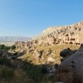 Best budget travel destinations for 2025, showing a traveler enjoying an affordable adventure in a scenic location.