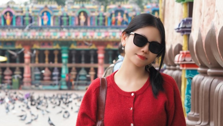 A confident travel nurse with a backpack overlooking a vibrant city, symbolizing the adventure, flexibility, and professional growth of cross-country travel nursing.