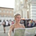 Solo traveler enjoying a picturesque European city street, representing the best places for independent adventure and cultural discovery in Europe.