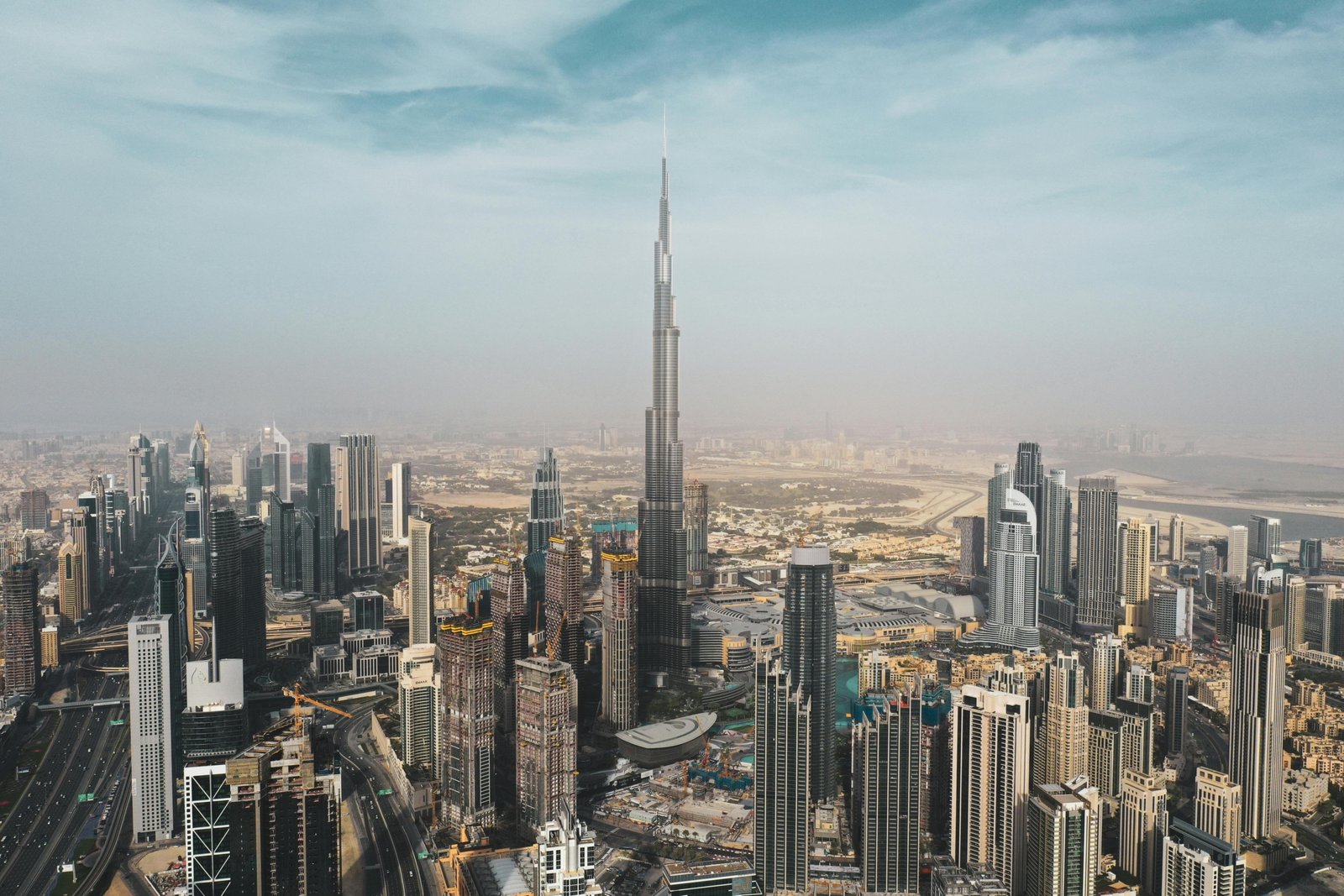 Dubai modern cityscape with iconic landmarks, featuring essential travel tips for first-time visitors.