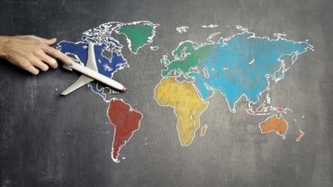 A backpacker enjoys a vibrant, culturally rich destination, illustrating the accessibility of cheap places to travel and inspiring budget-friendly world adventures.