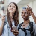 Person using a smartphone to find local sightseeing places and book nearby tours effortlessly.
