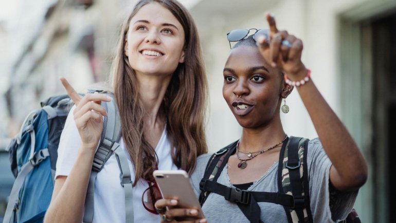 Person using a smartphone to find local sightseeing places and book nearby tours effortlessly.