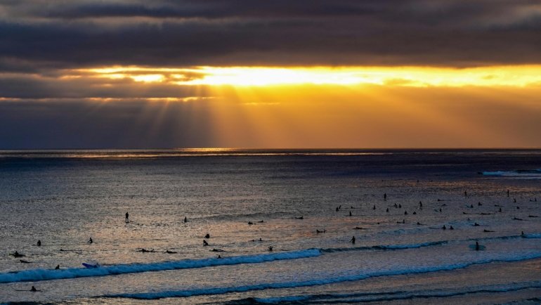 Scenic South Padre Island beach in Texas featuring vibrant blue waters and golden sand, ideal for a family vacation in 2025, highlighting new attractions and experiences.