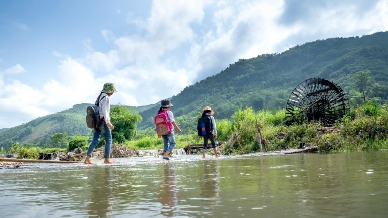 Happy people exploring a vibrant local neighborhood or serene natural park, symbolizing cool destinations near me and accessible day trip adventures.