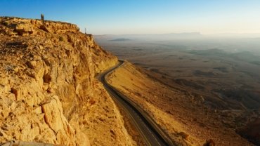 Vast and dramatic Negev Desert landscape in Israel, showcasing unique geological formations perfect for adventure tours.