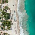 An aerial view of one of the best beaches in Mexico, featuring pristine white sand and vibrant turquoise water, an ideal destination for a 2025 getaway.