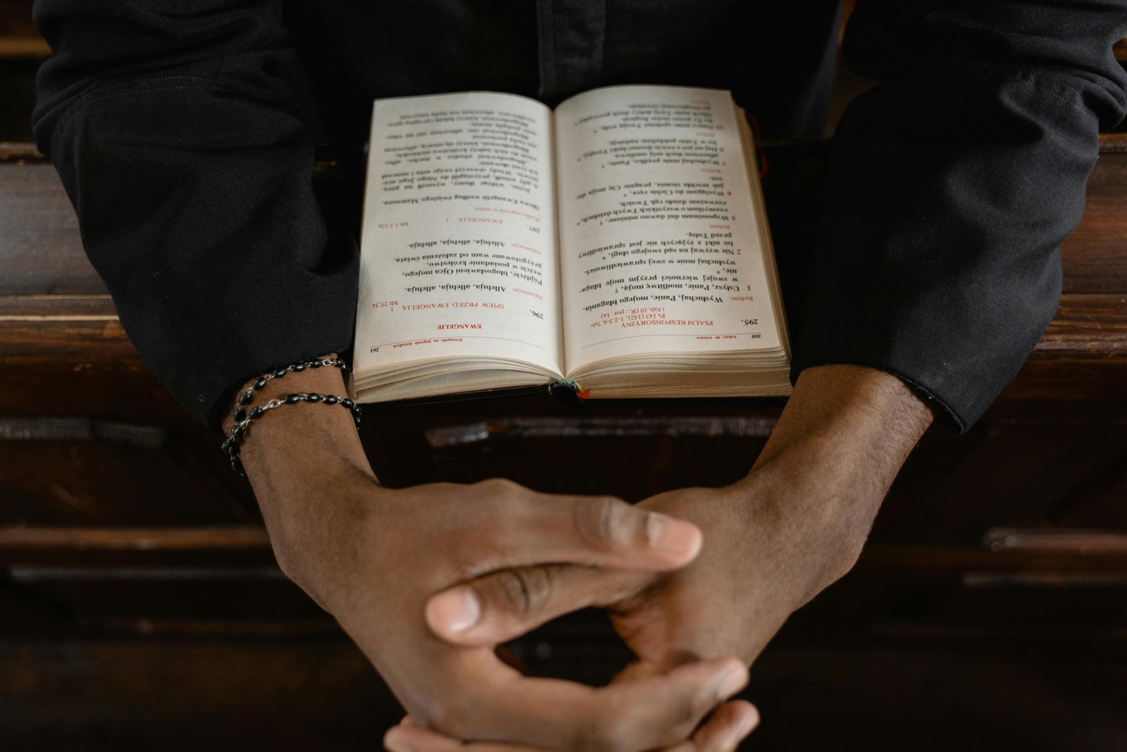 Christian prayer for safe travels, featuring hands clasped in prayer with a travel-related background, symbolizing divine protection and peace for journeys.