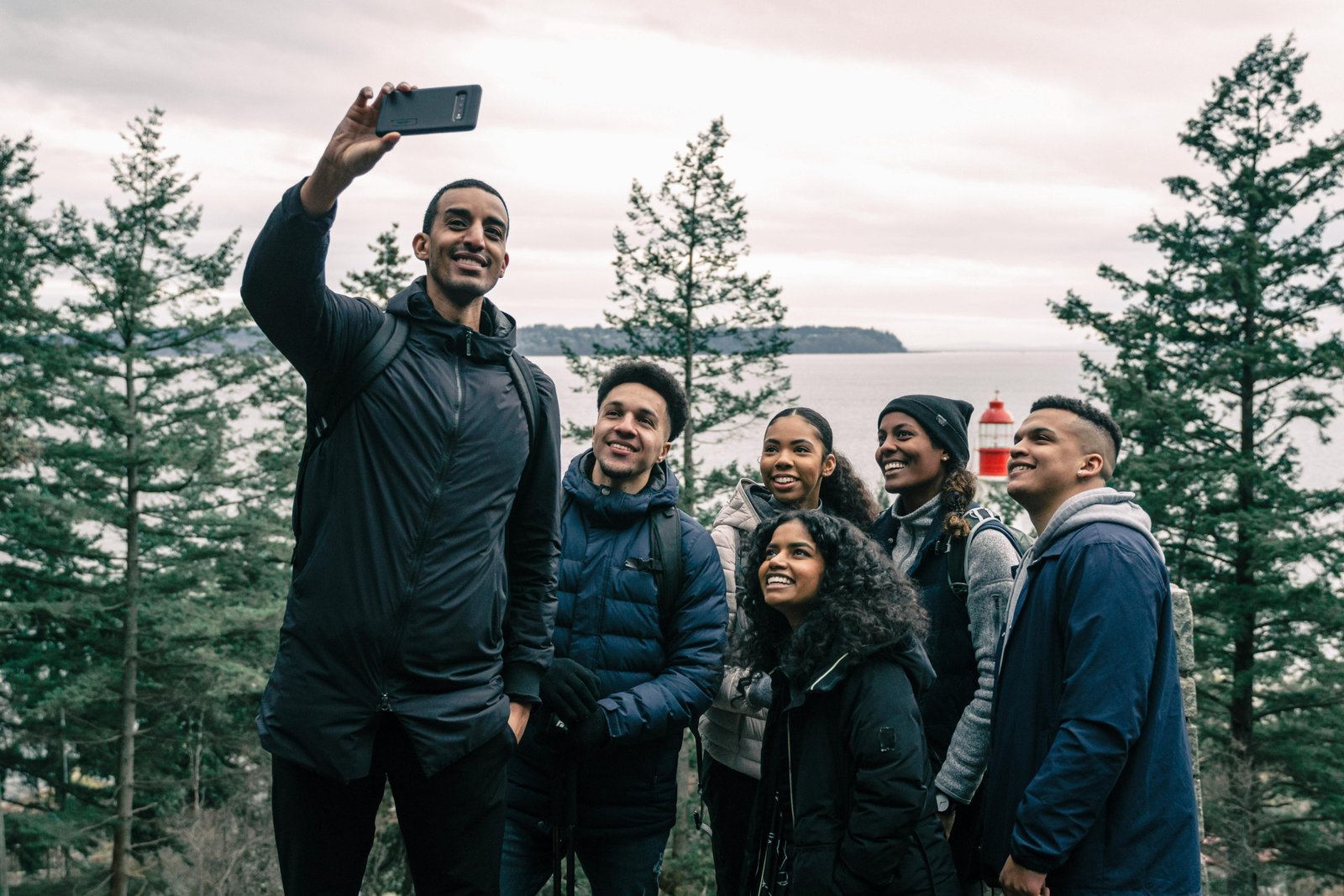 trekkersunite.com solo group travel adventure: diverse travelers connect and explore a stunning landscape with experienced guides, fostering new friendships.