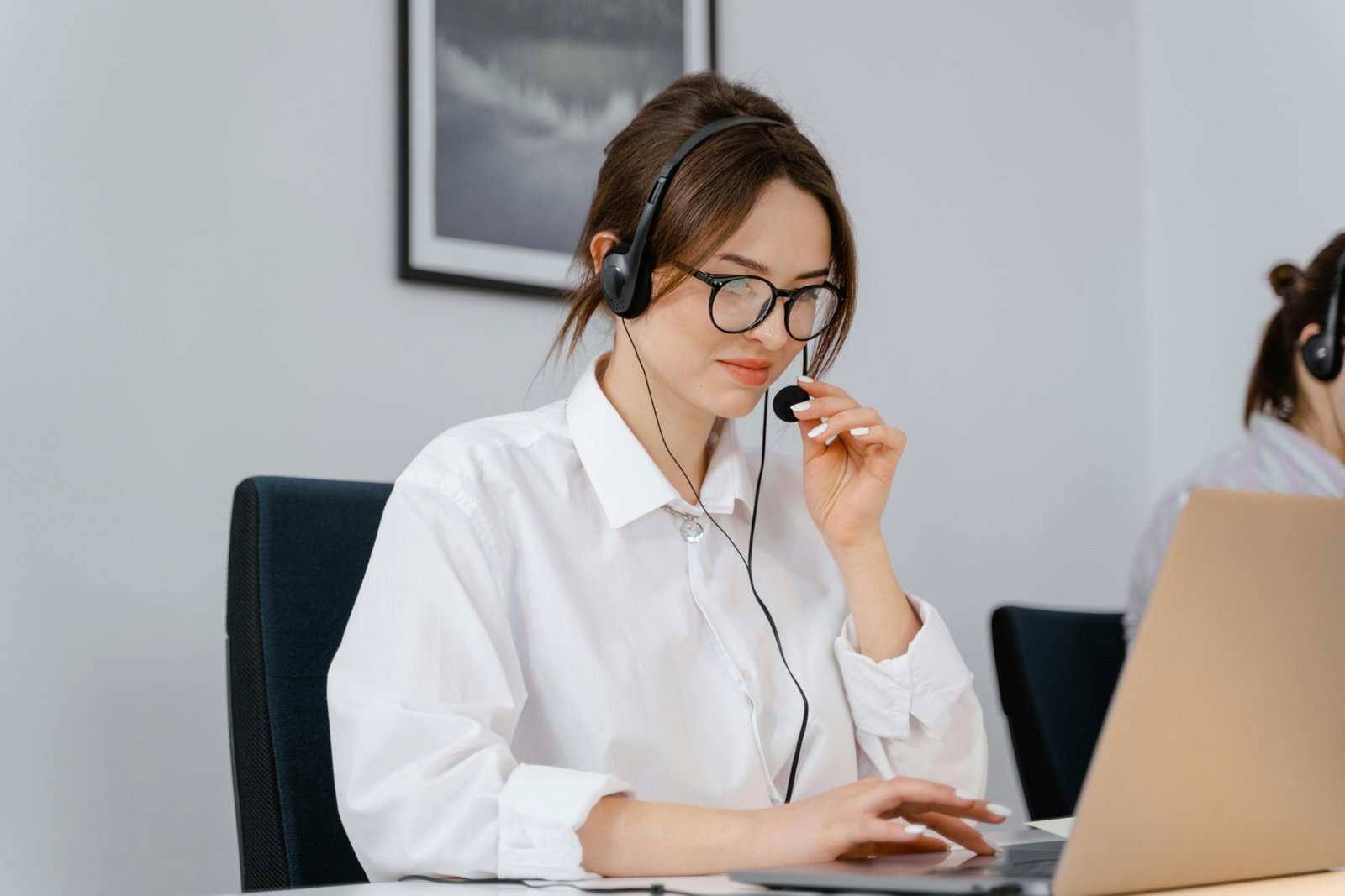 Independent travel agent confidently managing global bookings on a laptop, symbolizing the professional support and business growth offered by a travel agent host agency.