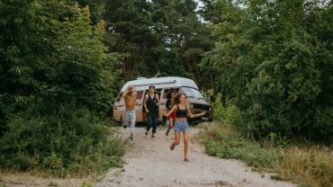 Happy person enjoying an affordable adventure made possible by budget travel hacks.