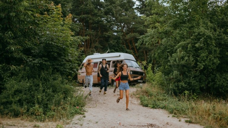 Happy person enjoying an affordable adventure made possible by budget travel hacks.
