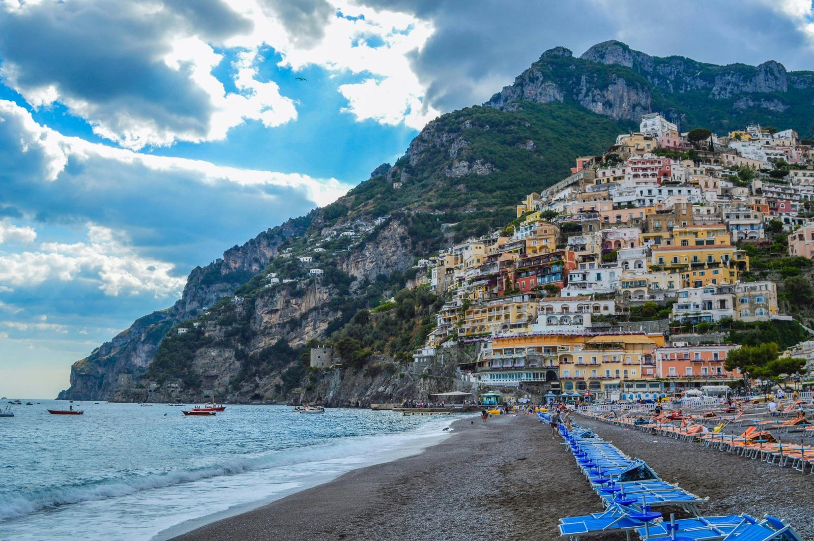 Panoramic view of an idyllic beach town with a beautiful coastline and charming homes, representing the best places for coastal living and a high quality of life.