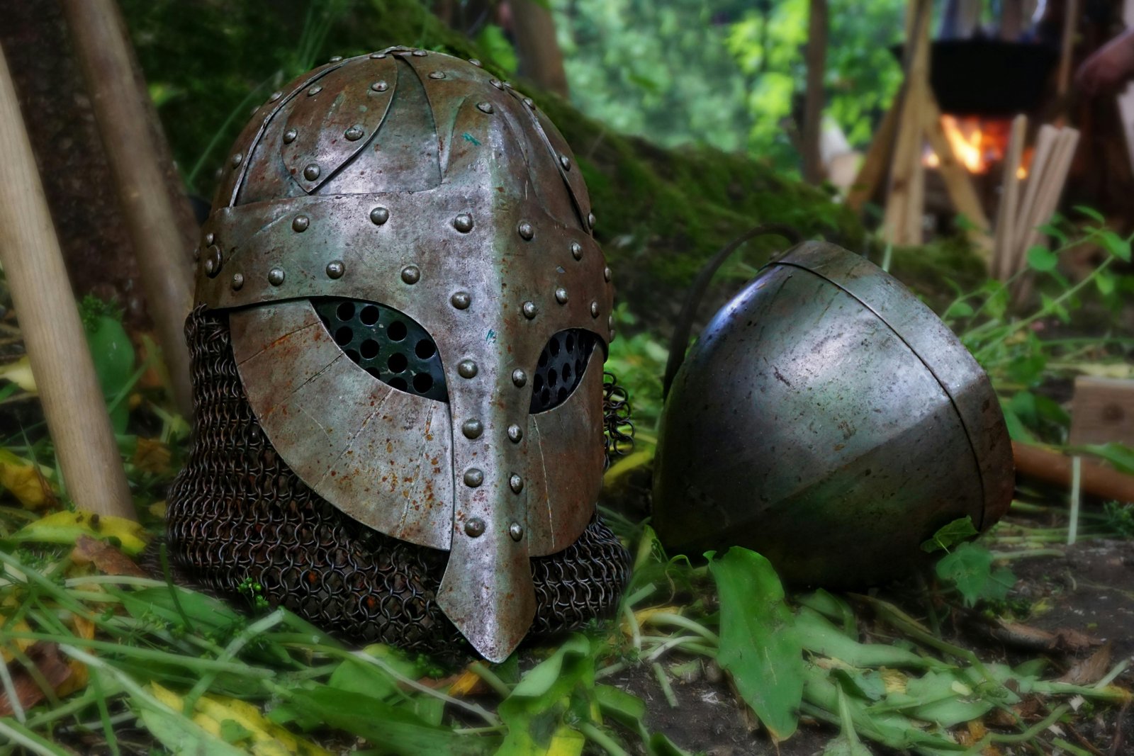 Collection of authentic historical militaria including a World War II helmet, vintage medals, and old documents, representing genuine military collectibles for discerning collectors.