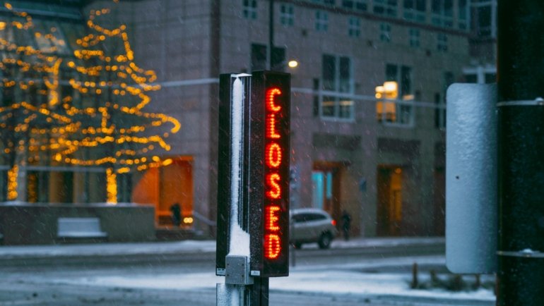 Snow-covered road in Buffalo, NY, during a severe winter storm and mandatory travel ban, highlighting the extreme conditions and importance of public safety.