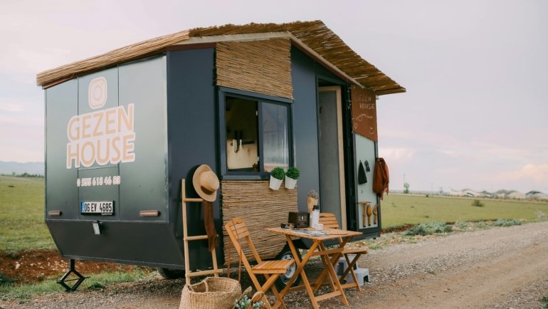 Top rated travel trailer for luxurious road trips and family adventures, parked in a scenic natural landscape, symbolizing freedom and comfort on vacation.