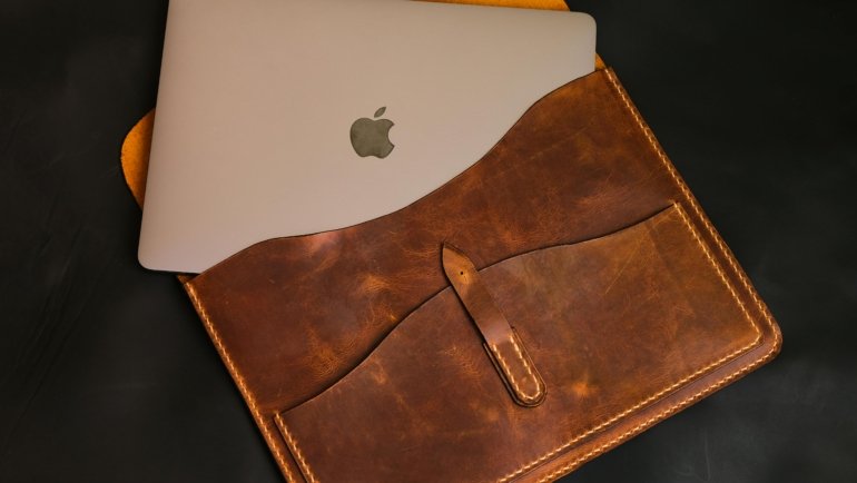 Elegant leather travel watch case securely holding a luxury watch, placed next to a passport and plane ticket, symbolizing peace of mind for valuable timepiece protection during travel.