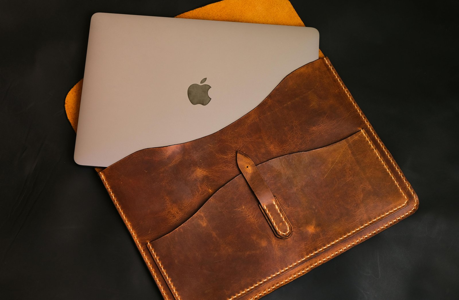 Elegant leather travel watch case securely holding a luxury watch, placed next to a passport and plane ticket, symbolizing peace of mind for valuable timepiece protection during travel.