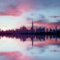 Panoramic view of Dubai's modern cityscape with iconic landmarks under clear skies, symbolizing the best time to plan an ideal travel vacation.