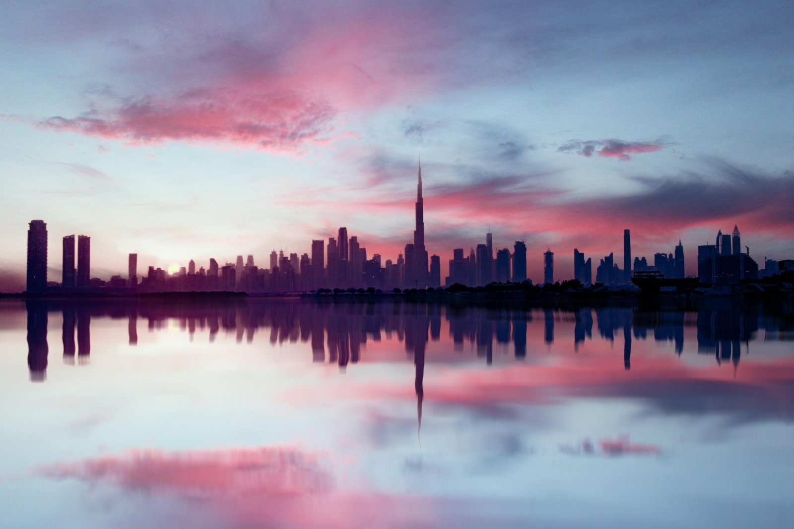 Panoramic view of Dubai's modern cityscape with iconic landmarks under clear skies, symbolizing the best time to plan an ideal travel vacation.