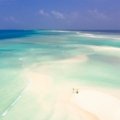 Idyllic white sand beach in Mauritius with crystal-clear turquoise water and a bright blue sky, illustrating the best time to travel to this Indian Ocean paradise for perfect weather and ideal holiday conditions.