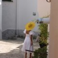 Stylish woman wearing a comfortable and versatile travel dress exploring a European city, perfect for light packing and effortless vacation outfits.