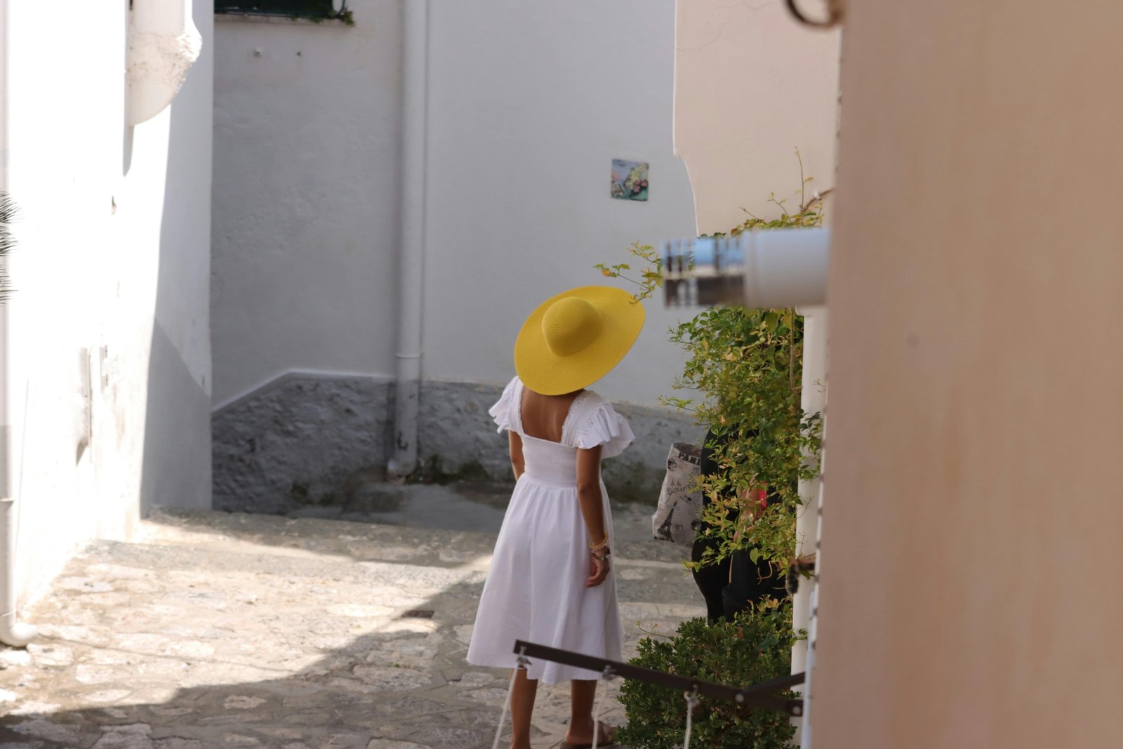 Stylish woman wearing a comfortable and versatile travel dress exploring a European city, perfect for light packing and effortless vacation outfits.