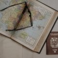 Passport, travel documents, and a map of Spain, clarifying visa requirements and Schengen Zone entry for confident travel.