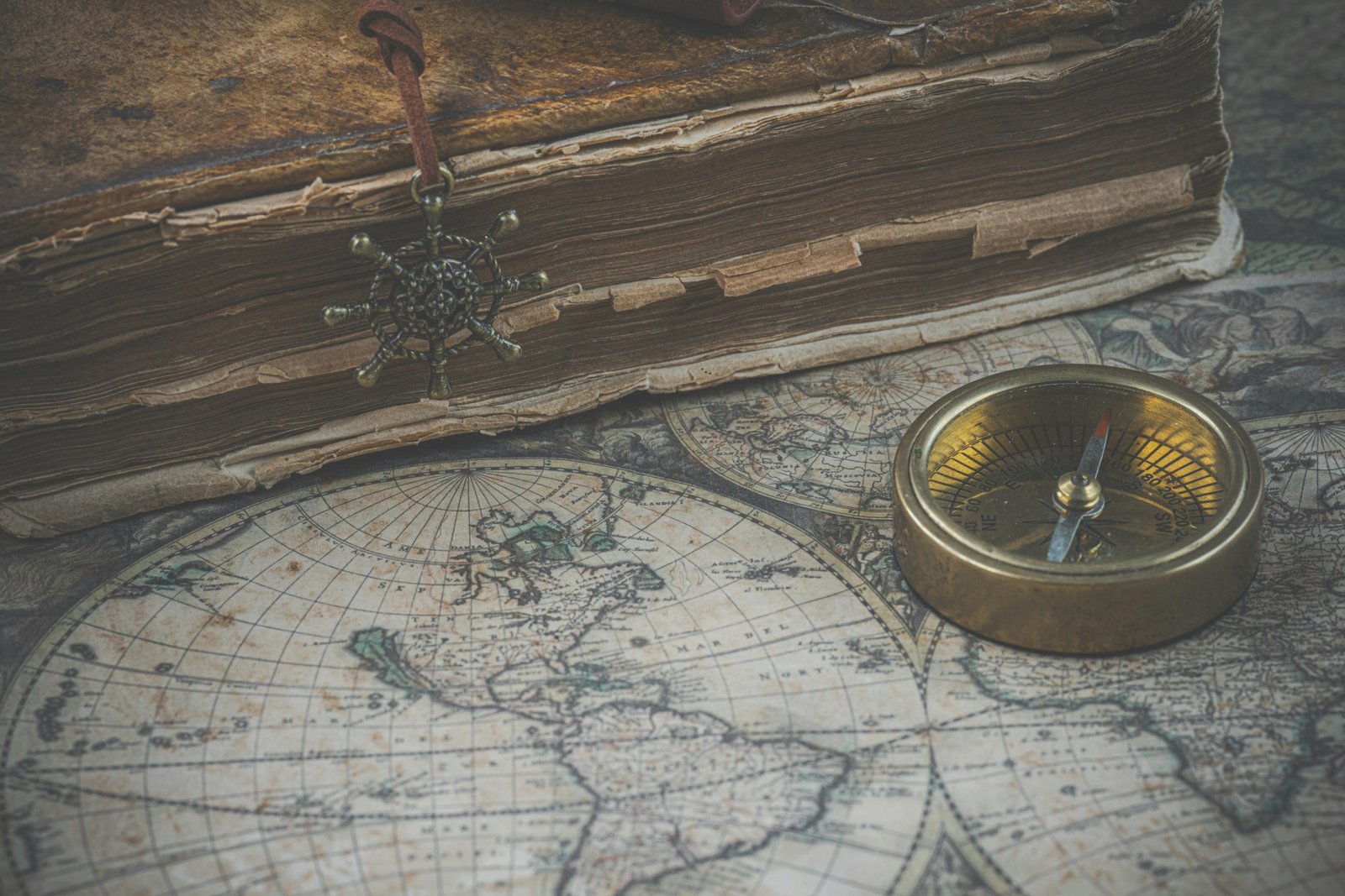 A close-up of a beautifully bound vintage edition of 'The Travels of Marco Polo' resting on an antique map, symbolizing the thrilling online quest for rare and collectible books on AbeBooks.