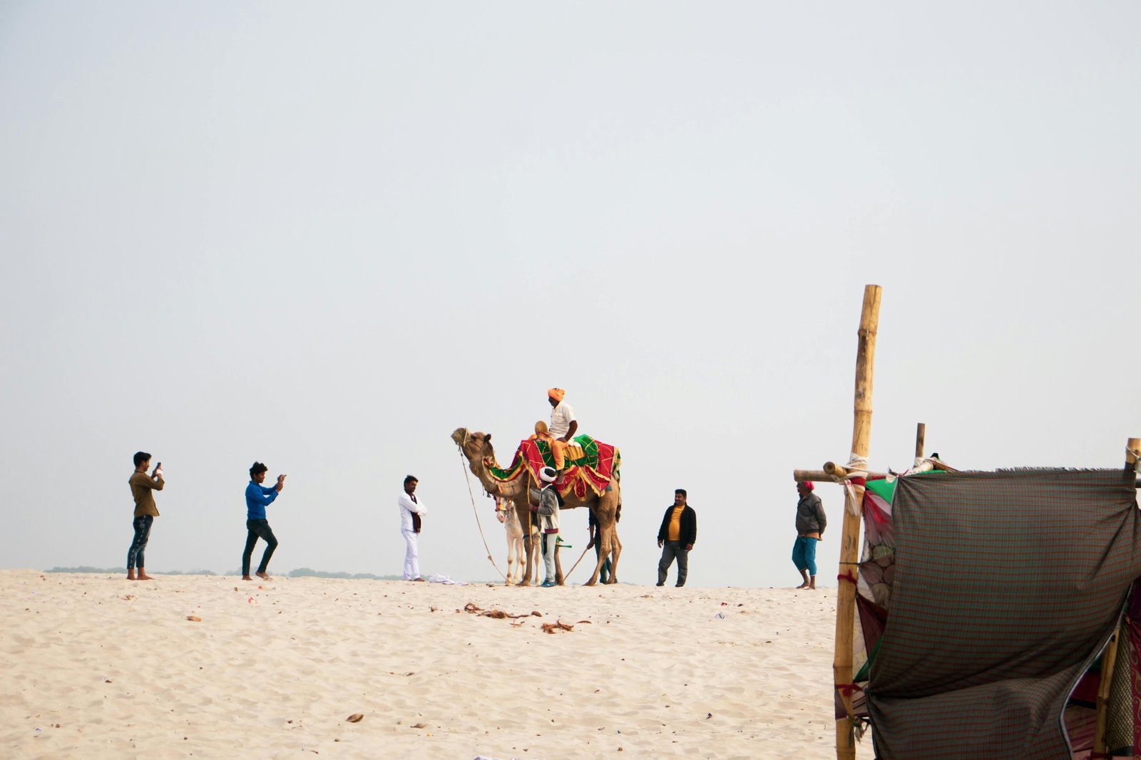 Diverse group of happy travelers on an organized Exoticca tour package, exploring an exotic landmark and highlighting the great value and adventure.