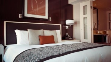Comfortable and clean guest room at Travel Inn San Antonio, offering essential amenities and affordable accommodation for budget travelers exploring San Antonio, Texas.