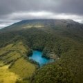 Lush Costa Rica landscape with vibrant rainforest, majestic volcano, and tropical beach, illustrating a 10-day travel itinerary for nature and adventure seekers.